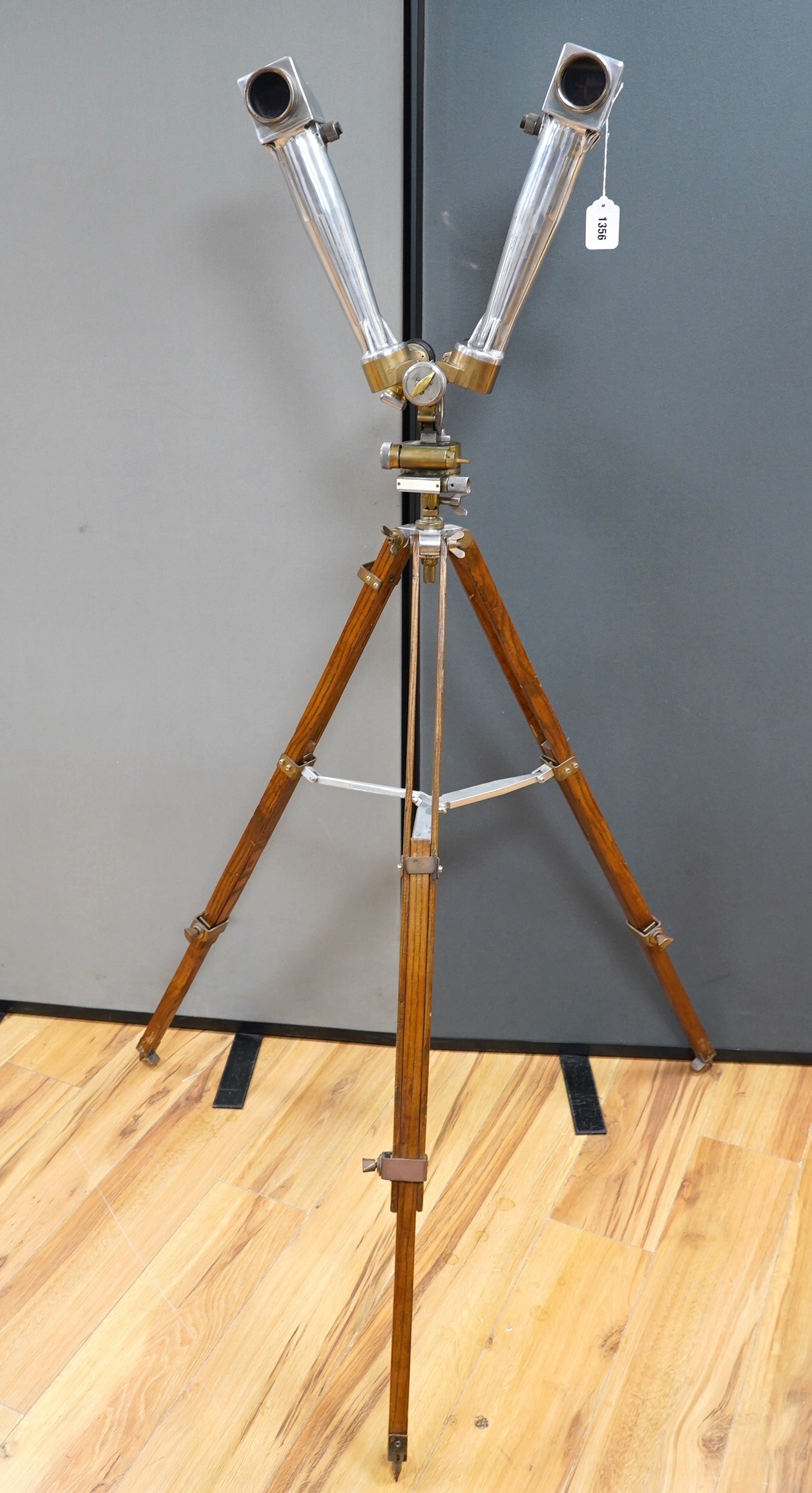 A pair of Czech army polished alloy and brass ‘donkey ears’ trench binoculars, stamped ‘ASZT. 10x45 522660 41 1956’, together with the correct oak tripod stand. Condition - fair to good